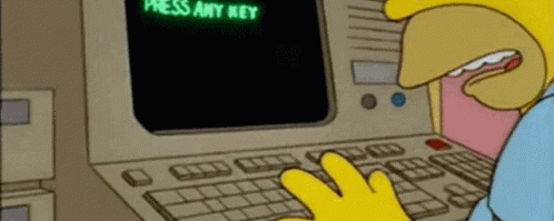Press the any key gif. Homer looking for the any key.
