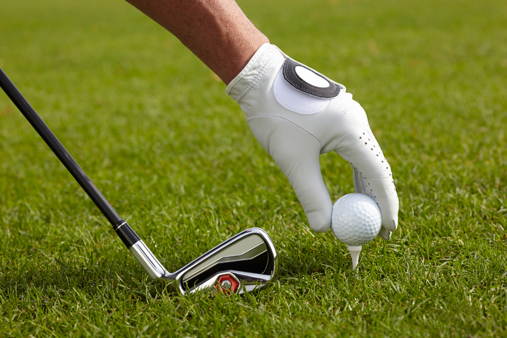 setting up golf tee