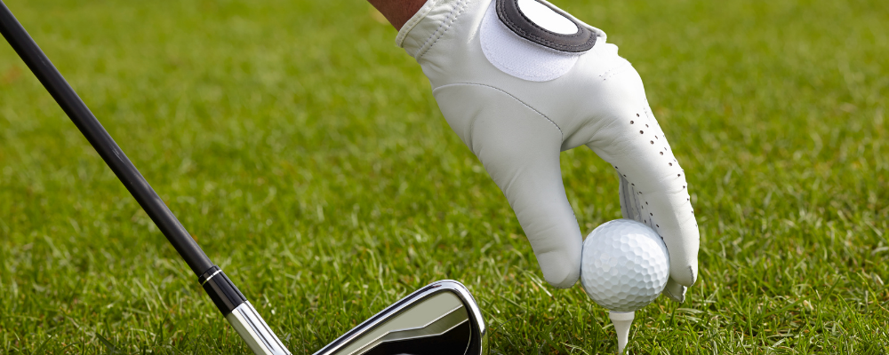 setting up golf tee